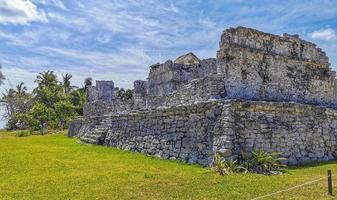 Ancient Tulum ruins Mayan site temple pyramids artifacts seascape Mexico. photo