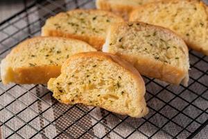 Slices of toasted bread with garlic and herbs photo