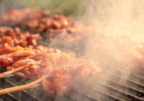 Grilled chicken with smoke. photo