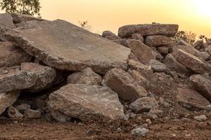 Concrete debris piles on the ground. photo