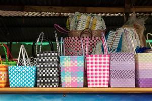 Many colorful plastic baskets in shop sheds. photo
