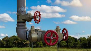 Large water valve with sky clouds. photo