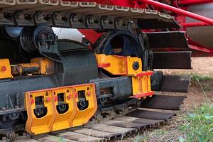 Steel wheels, tracked vehicles, combine harvester. photo