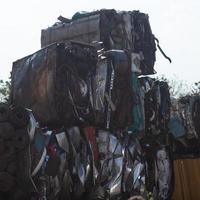 Steel scraps compressed into cubes, preparing to be recycled. photo