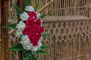 Artificial rose bouquet with bamboo. photo