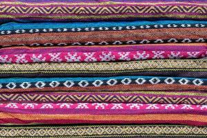 Folded colorful patterned scarves. photo