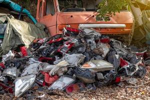 Many car headlights are left behind. photo