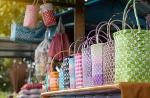 Many colorful plastic baskets in shop sheds. photo