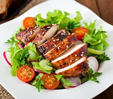 Fresh vegetable salad with grilled  chicken breast. photo