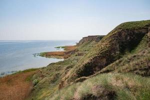 Beautiful summer landscapes with clay cliffs near delta of river Dnieper and Black sea photo