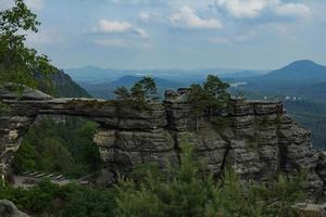 Landscape in mountains in Czech Switzerland national park, pine forest and rocks photo