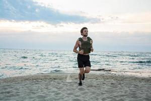 Young bearded athlete training outdoor with weighted vest, exercise with military plate carrier photo