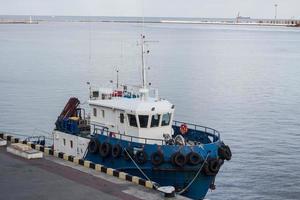 sea port landscape with tow boat photo