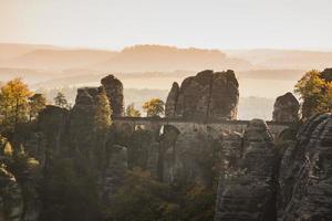 autumn landscape with mountains and bastei bridge photo