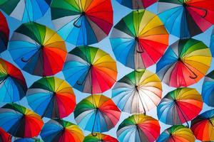 outdoors decoration with many colorful umbrellas against blue sky and sun photo