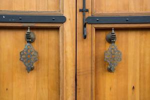 close up of old wooden door with metal details photo