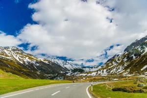 Road amoung snowy Alps mountains, Fluelapass, Davos,  Graubuende photo