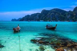 Long tail boats on tropical beach, Phi Phi Don island, Andaman s photo