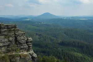 Landscape in mountains in Czech Switzerland national park, pine forest and rocks photo