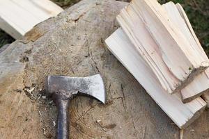 Close up piture of chopping firewood, country photo with wood and axe