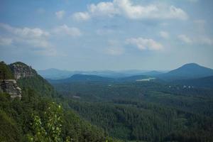 Landscape in mountains in Czech Switzerland national park, pine forest and rocks photo