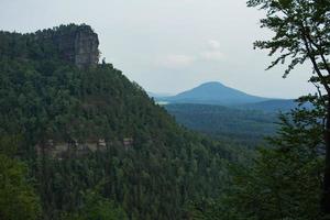 Landscape in mountains in Czech Switzerland national park, pine forest and rocks photo