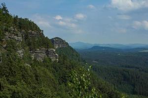 Landscape in mountains in Czech Switzerland national park, pine forest and rocks photo