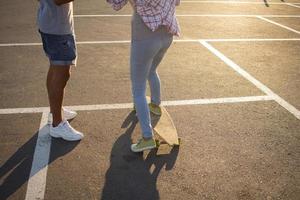 longboard skate stand alone on asphalt in yellow sunlight photo