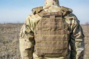 Close up of army uniform on the soldier photo