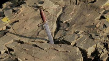 Excalibur sword in rocky stone at sunset video