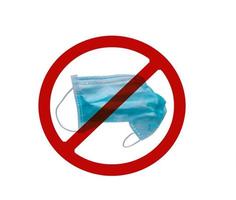 Used blue surgical face mask in red forbidden symbol on white background. No discard used medical face mask in this area. Medical waste management with hygienic rule in hospital and community. photo