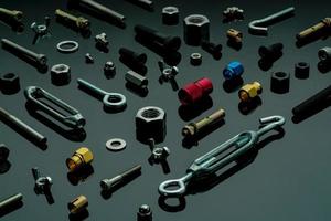 Metal bolts, nuts, and washers. Fasteners equipment. Hardware tools. Different types of nuts, bolts, and screws on table in workshop. Mechanic tools. Threaded fastener use in automotive engineering. photo