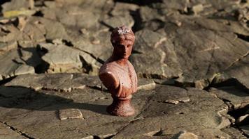 ancient statue of woman on rocky stones video