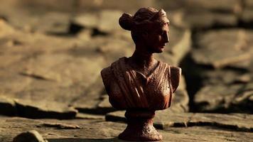 ancient statue of woman on rocky stones video