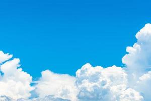 Beautiful blue sky and white cumulus clouds abstract background. Cloudscape background.  Blue sky and fluffy white clouds on sunny day. Nature weather. Bright day sky for happy day background. photo