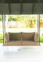 empty sofa swing in garden photo