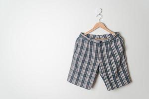 short pants hanging on wall photo