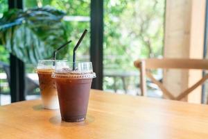 iced black coffee takeaway glass on table in coffee shop cafe restaurant photo