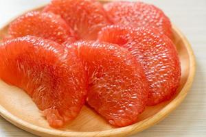 fresh red pomelo fruit or grapefruit photo