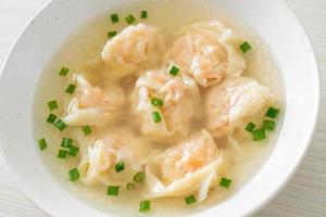 shrimp dumpling soup in white bowl photo