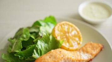 homemade fried salmon steak with lemon and vegetable - healthy food style video