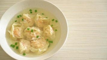 shrimp dumpling soup in white bowl - Asian food style video