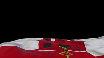 Gibraltar fabric flag waving on the wind loop. Gibraltar embroidery stiched cloth banner swaying on the breeze. Half-filled black background. Place for text. 20 seconds loop. 4k video