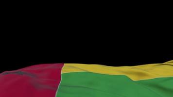 Guinea Bissau fabric flag waving on the wind loop. Guinea Bissau embroidery stiched cloth banner swaying on the breeze. Half-filled black background. Place for text. 20 seconds loop. 4k video