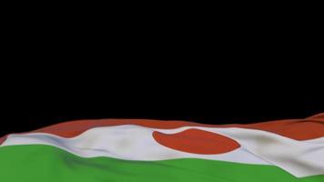 Niger fabric flag waving on the wind loop. Niger embroidery stiched cloth banner swaying on the breeze. Half-filled black background. Place for text. 20 seconds loop. 4k video