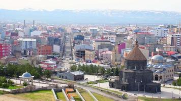 Aerial panning view Kars mosque with city panorama in eastern Turkiye video