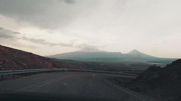 Point of view driving on asphalt road nature outdoors on adventure tour towards Ararat mountain peak in Kars, turkey. Road trip central anatolia, Turkiye video