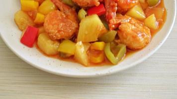 Stir-fried sweet and sour with fried shrimp on plate - Asian food style video