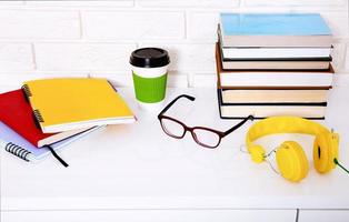 Workplace and education accessories on white table. Selective focus and copy space. Business school concept photo