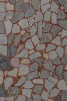 Muro de hormigón y piezas de piedra pulida. foto